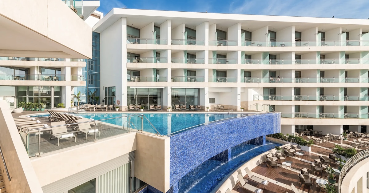 A modern oceanfront conference hotel with a terrace pool